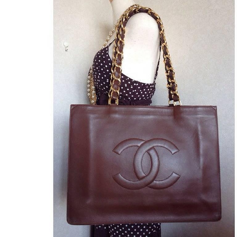 Vintage CHANEL brown calfskin large tote bag with gold tone chain handles and CC 5