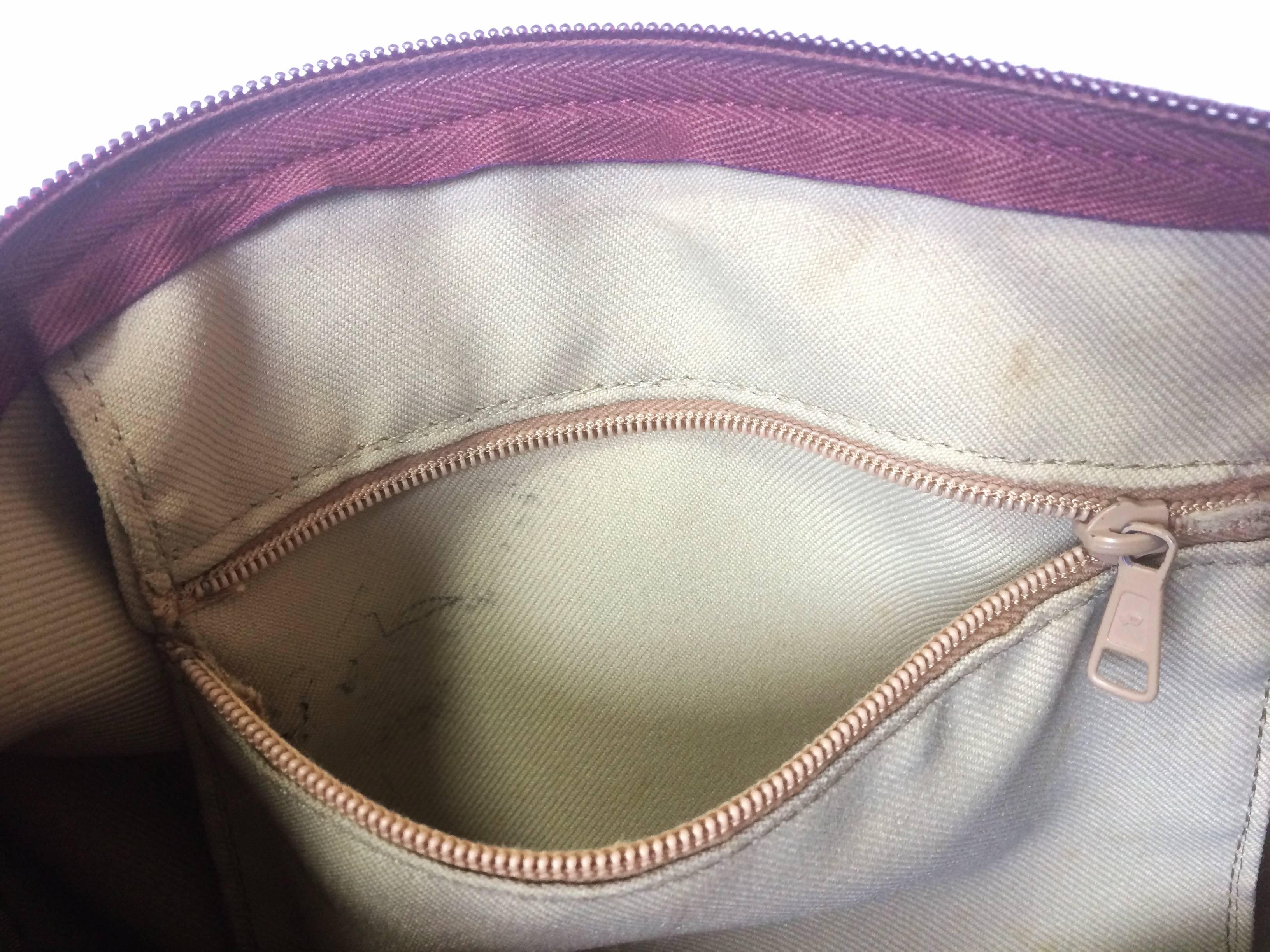 Women's or Men's 80's Vintage Longchamp rare dark wine leather duffle bag, mini travel purse.  For Sale