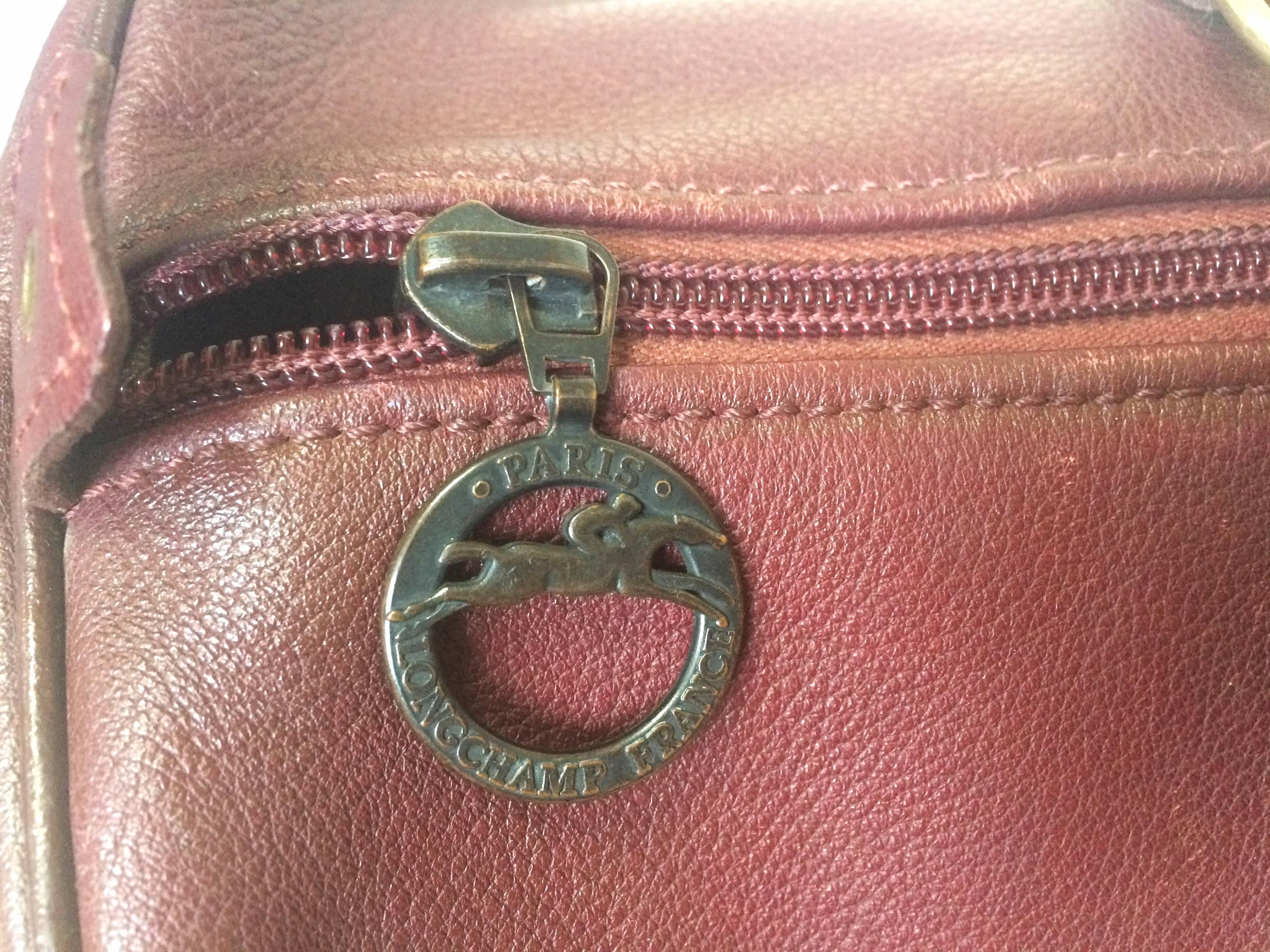 Pink 80's Vintage Longchamp rare dark wine leather duffle bag, mini travel purse.  For Sale