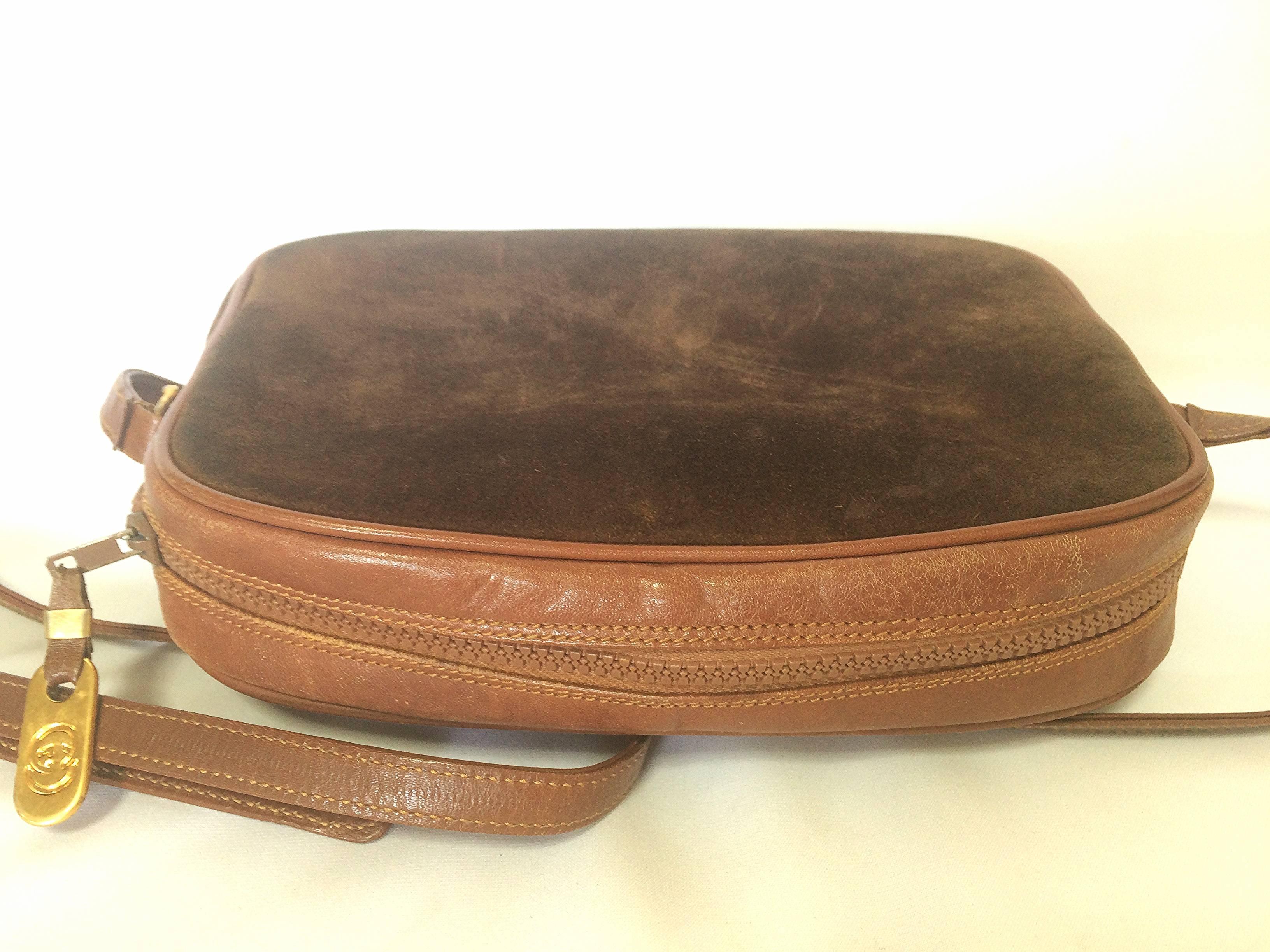 Brown Vintage Gucci brown suede oval shape shoulder purse with riri zippers.