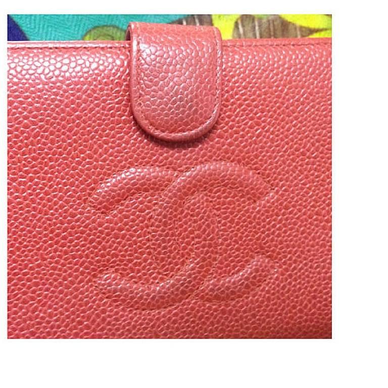 Vintage CHANEL red caviar leather wallet with large CC logo stitch mark. Classic caviar leather and perfect gift.

This is a CHANEL vintage wallet in lipstick red caviar leather. 
Modest, simple and elegant.
It is something that would never go