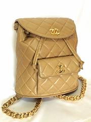 Vintage CHANEL brown beige lambskin backpack with golden chain straps with cc.