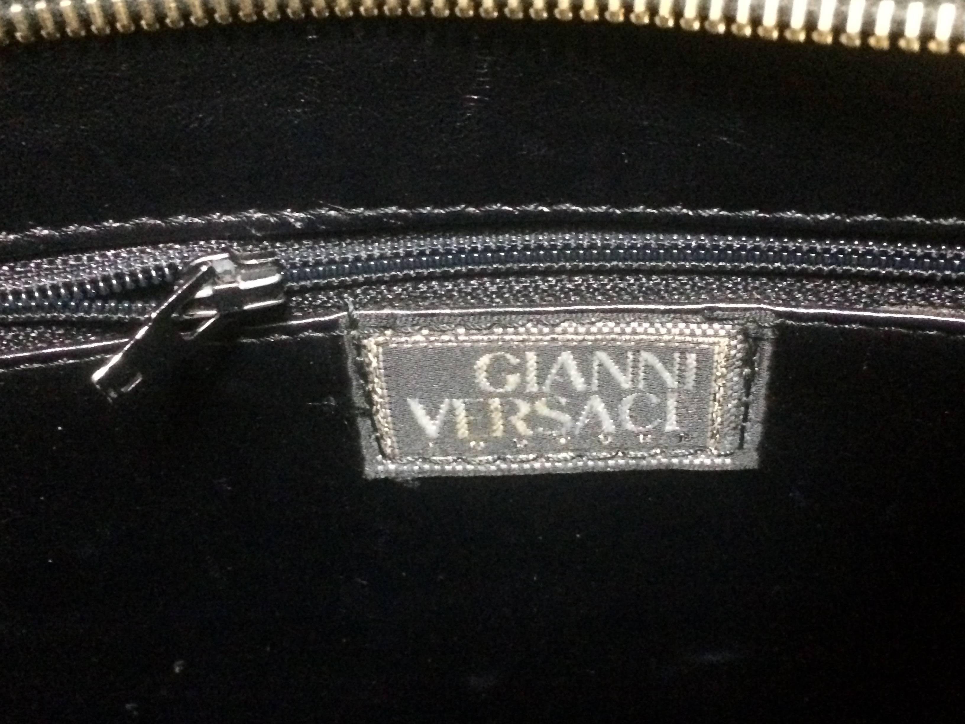Vintage Gianni Versace black tote bag with golden medusa charms and handles. 3