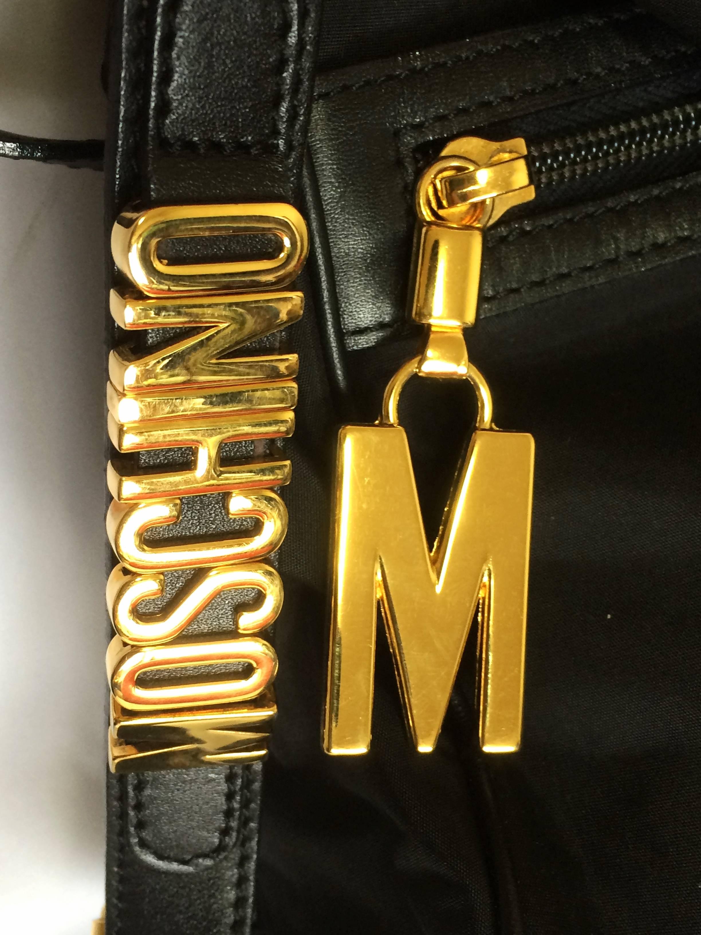 Women's or Men's MINT. Vintage Moschino black nylon saumur messenger shoulder bag with leather For Sale