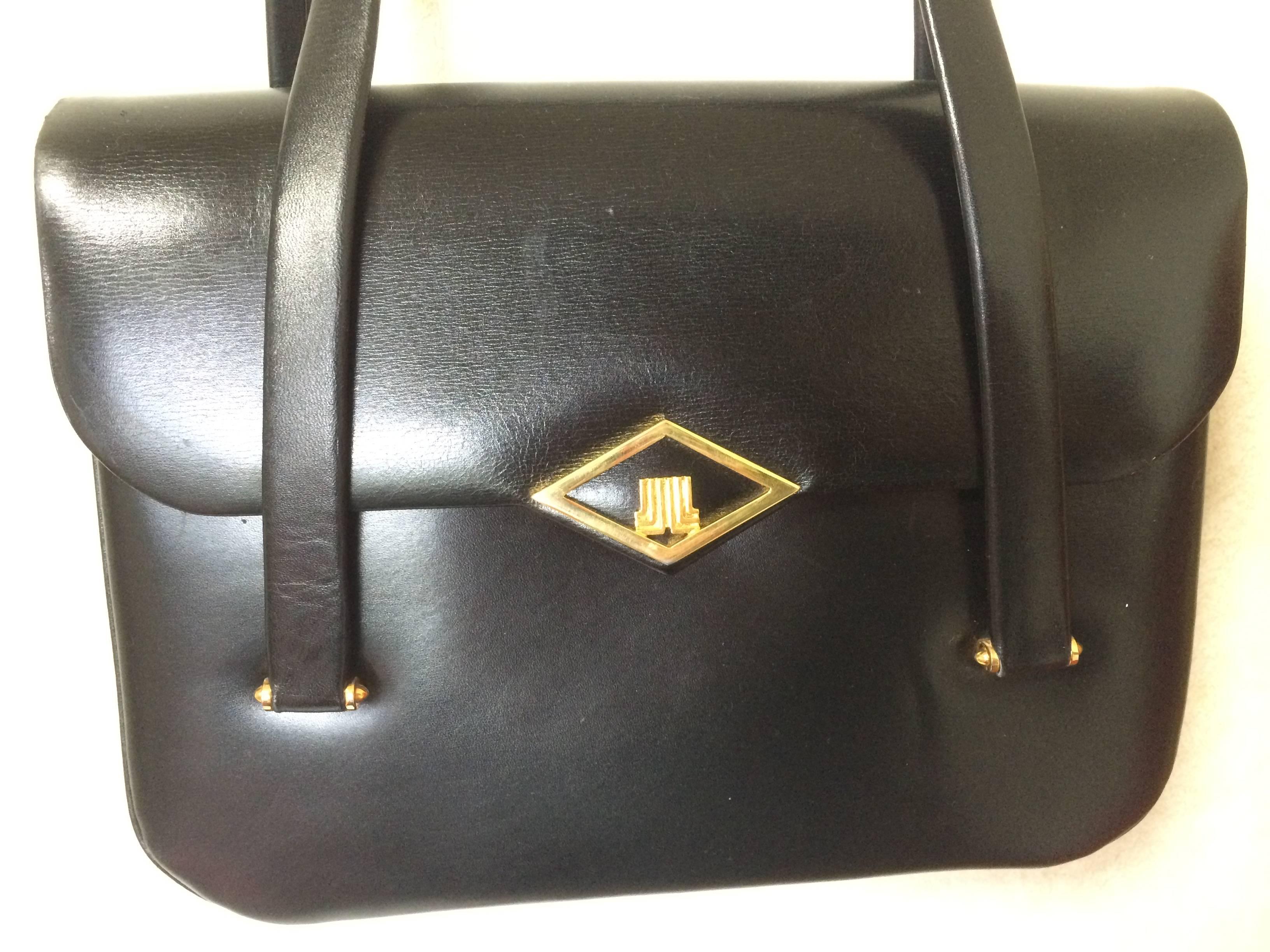 1980's Vintage LANVIN classic black leather shoulder bag, tote bag with golden logo motif.

Introducing a vintage LANVIN classic black leather purse that would suit for any occasions. 
The golden logo hardware is at the front flap.
Overall,