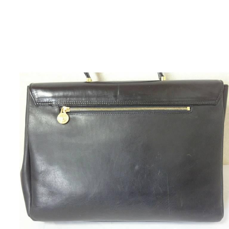 Women's Vintage Gianni Versace genuine black leather Kelly style bag with Sunburst motif