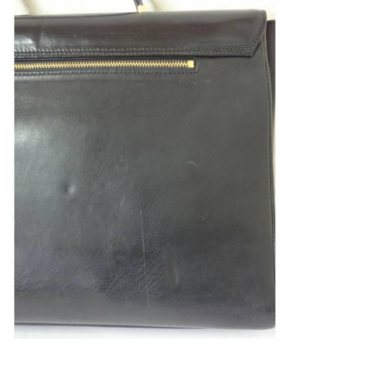 Vintage Gianni Versace genuine black leather Kelly style bag with Sunburst motif 1