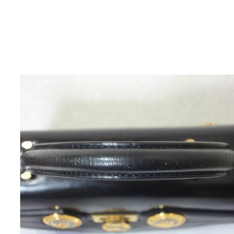 Vintage Gianni Versace genuine black leather Kelly style bag with Sunburst motif 3