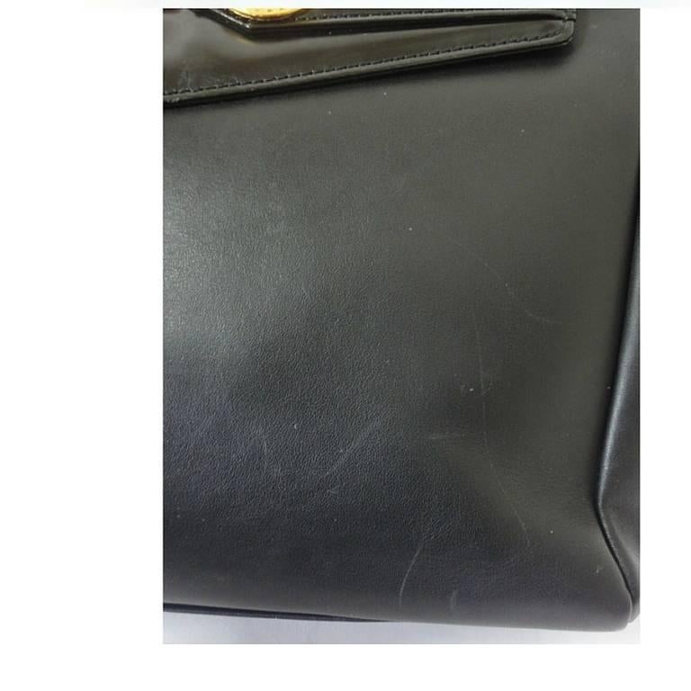 Black Vintage Gianni Versace genuine black leather Kelly style bag with Sunburst motif