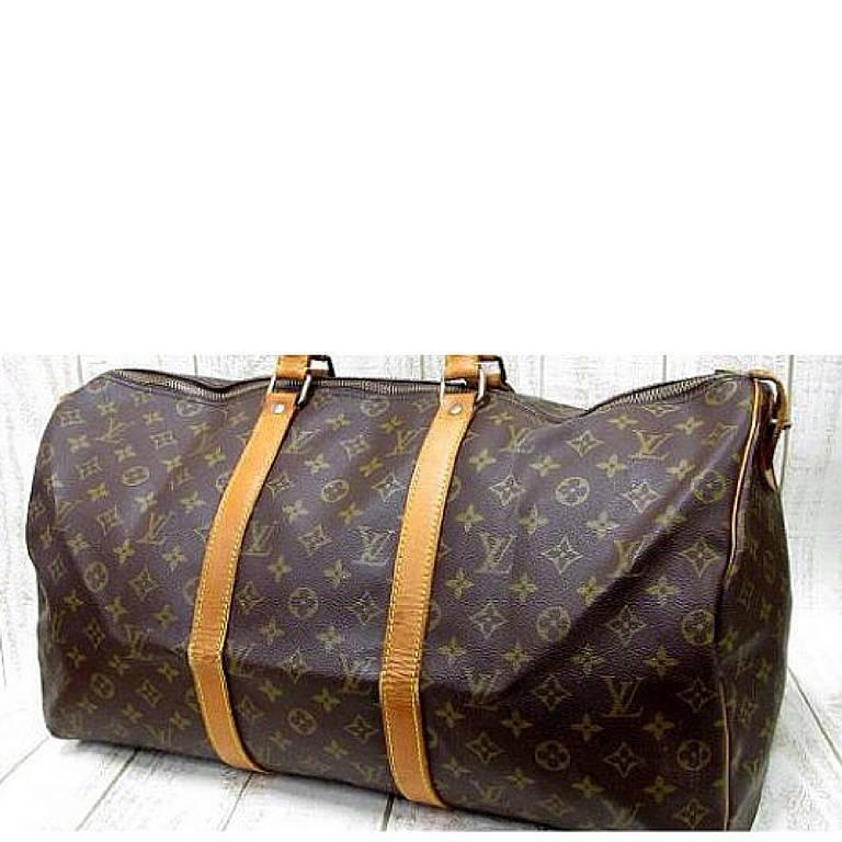 1980s. Vintage Louis Vuitton monogram travel keepall 50 duffle bag. Bandouliere purse. Great vintage condition. Unisex use for all generations.

This is a large Louis Vuitton vintage travel bag, Keepall 50 / Bandouliere purse from the 80's.         