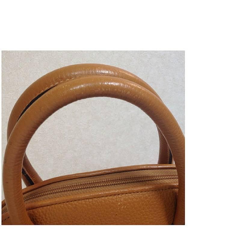 Vintage FENDI tanned brown leather bolide style bag with shoulder strap. For Sale 1