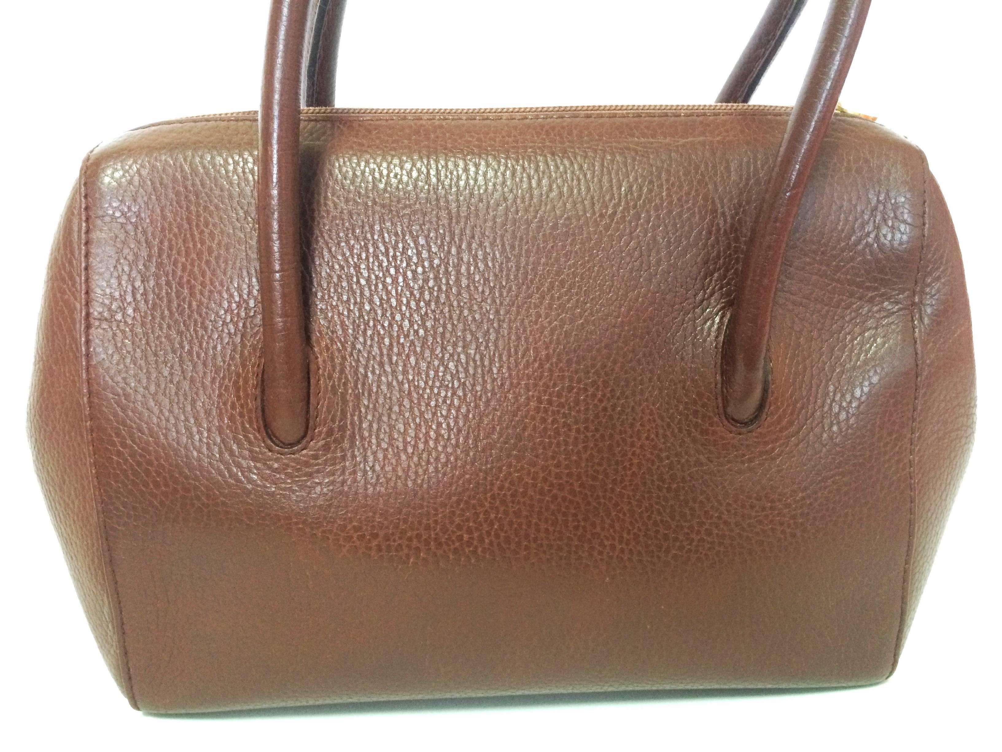 Brown Vintage Cartier classic brown leather handbag with logo.  les must de Cartier