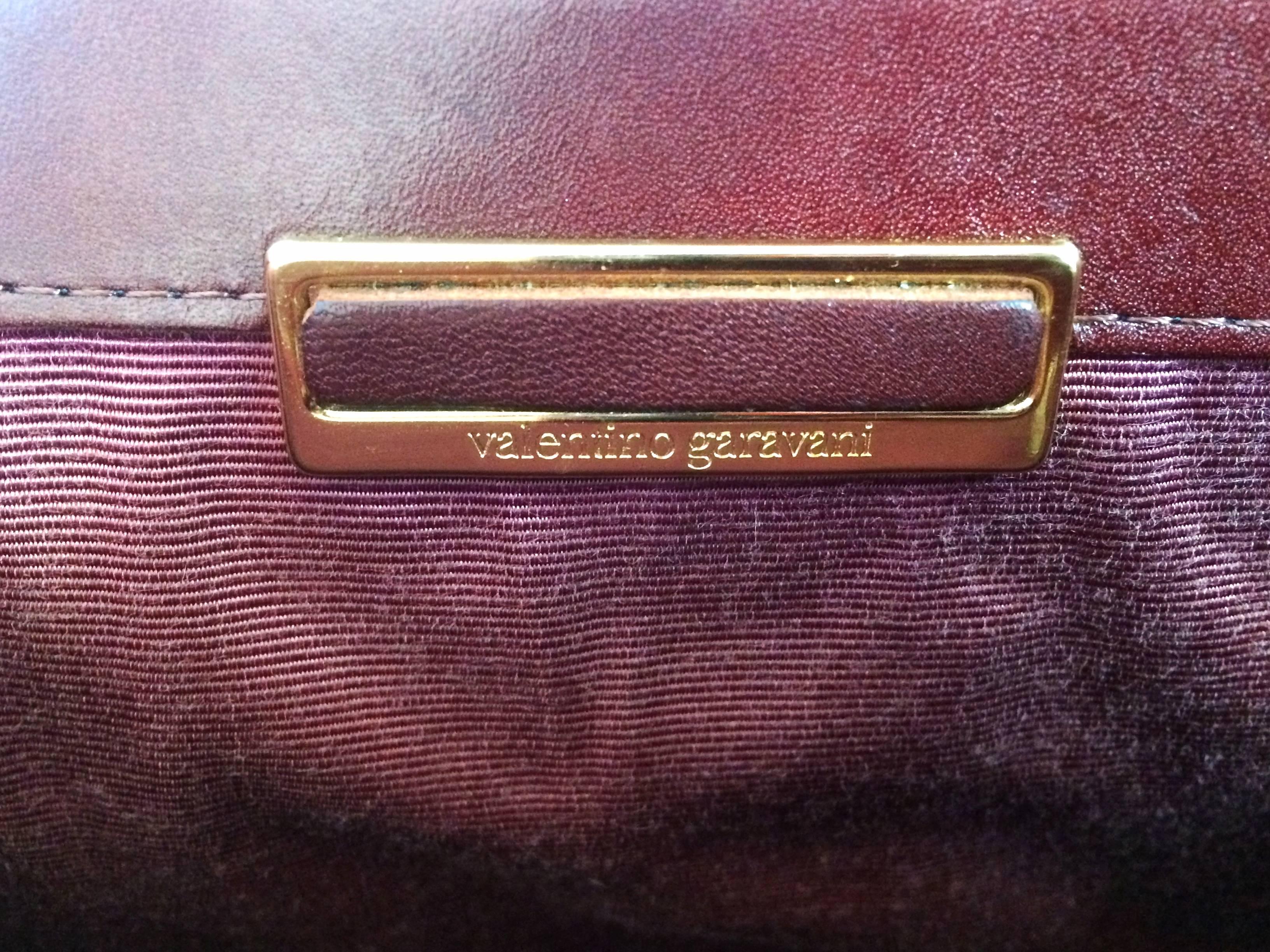 Vintage Valentino Garavani wine epi and smooth leather handbag with buckle flap. 1