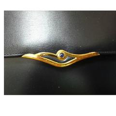 Vintage Cartier black navy  leather classic shape clutch bag with blue stone.