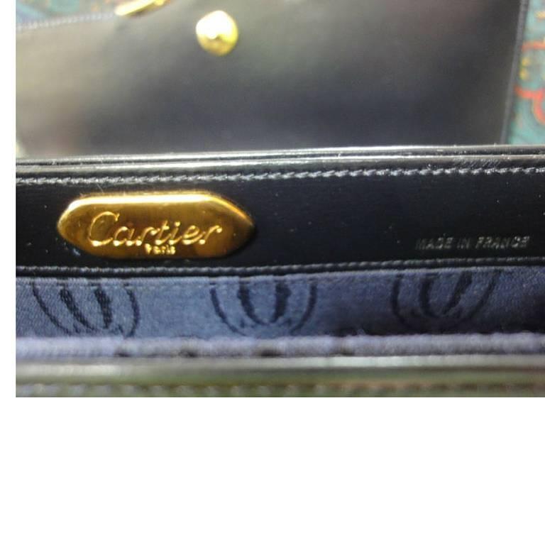 Vintage Cartier black navy  leather classic shape clutch bag with blue stone. For Sale 1