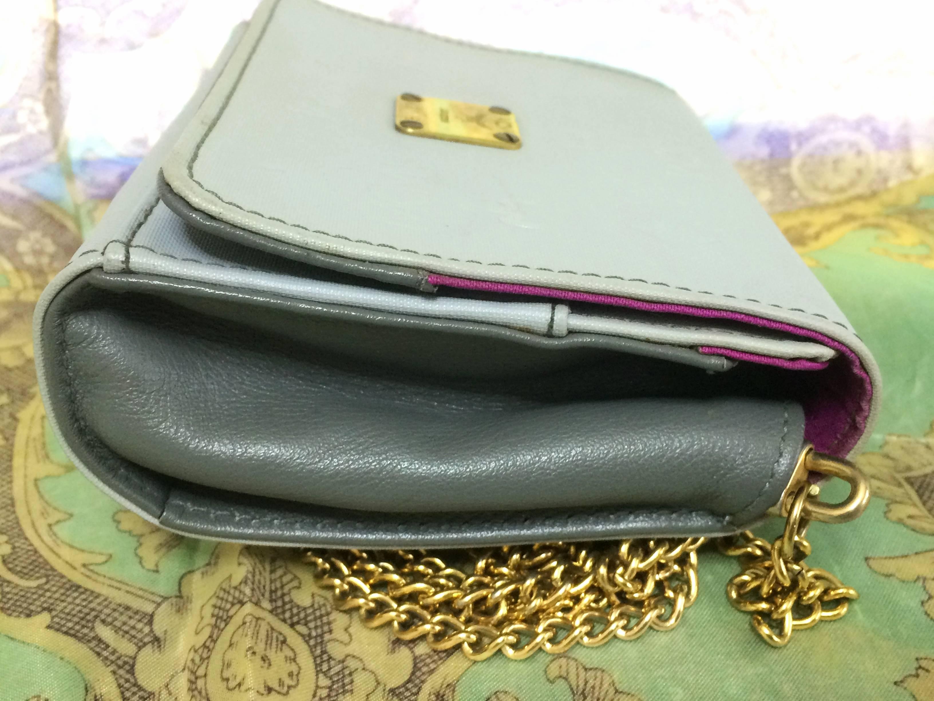 Women's Vintage MCM light grey monogram and purple interior mini clutch shoulder bag. For Sale