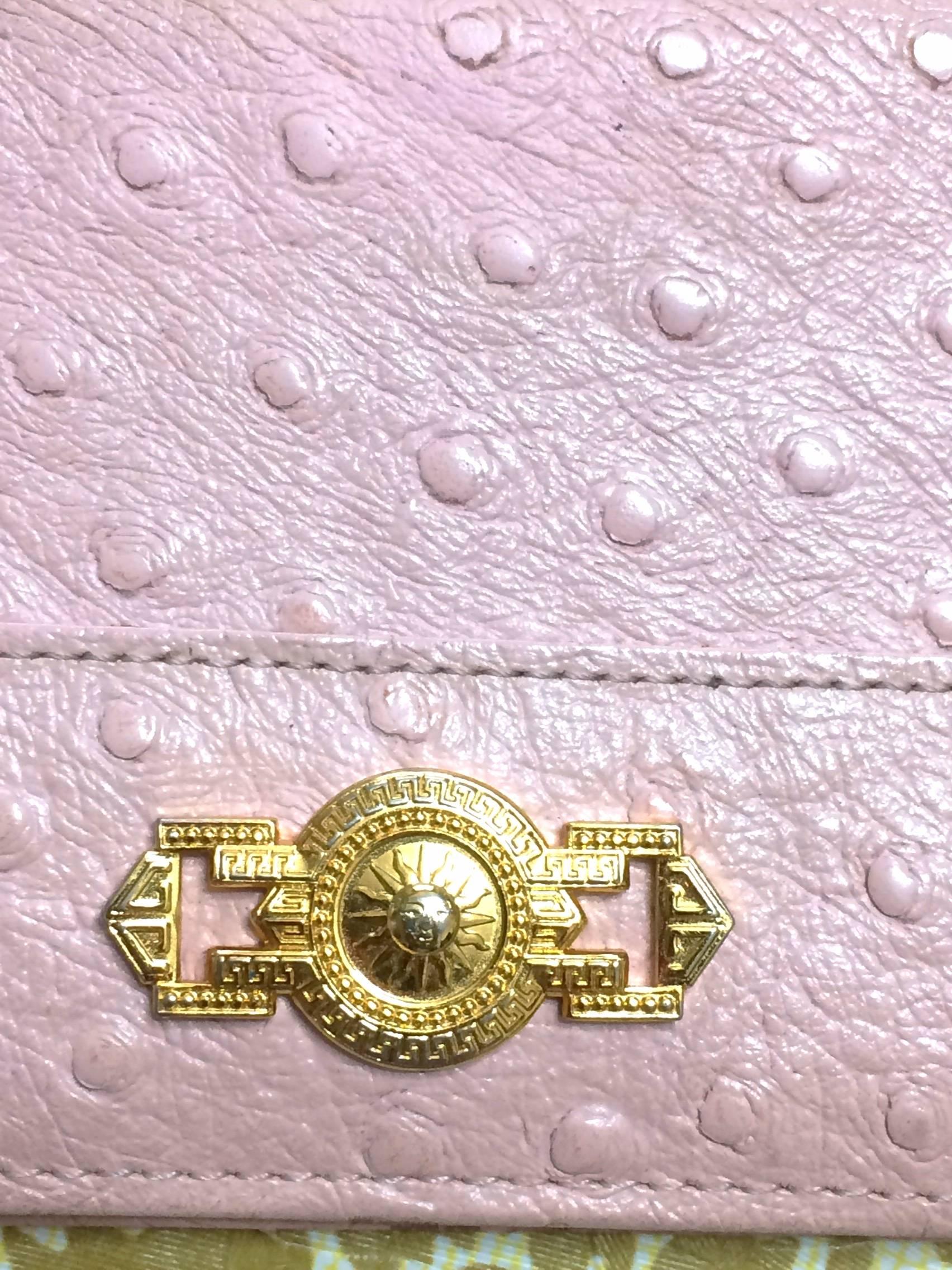 1990s. Vintage Gianni Versace ostrich-embossed pink leather card, id case, card case with golden sunburst charm. Best gift for Unisex.

Here is another vintage piece from Gianni Versace, ostrich-embossed pink leather card, ID, pass case for unisex
