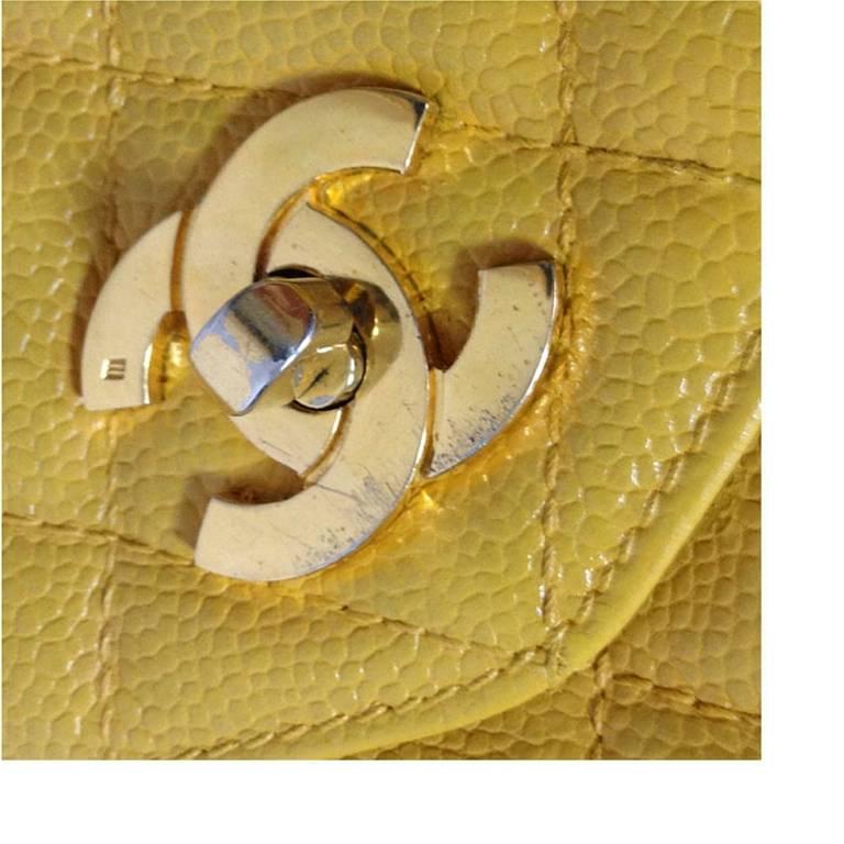 Yellow Vintage Chanel yellow caviar leather chain shoulder tote bag with golden CC. For Sale