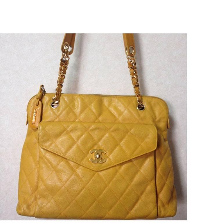 1990s. Vintage Chanel yellow caviar leather chain shoulder bag with golden CC closure. Lucky and good fortune color for you.

Here is your good fortune color, yellow caviarskin tote bag from CHANEL.
Classic and functional size bag for your daily
