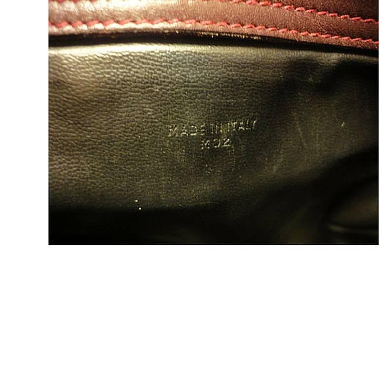 Women's 80's vintage Celine shoulder purse in bordeaux, burgundy leather with blason. For Sale