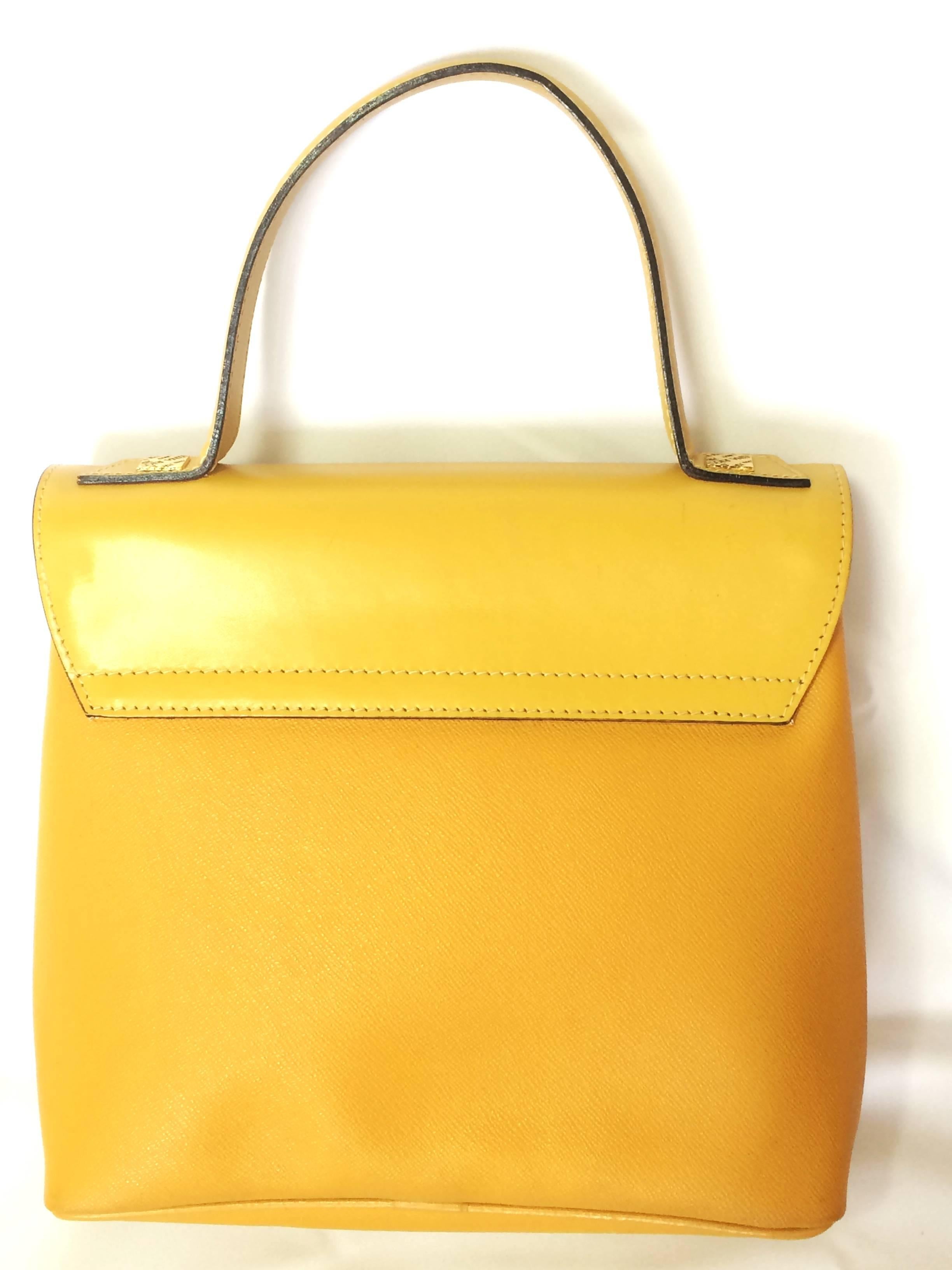 Yellow MINT. Vintage Nina Ricci yellow leather handbag purse with shoulder strap.