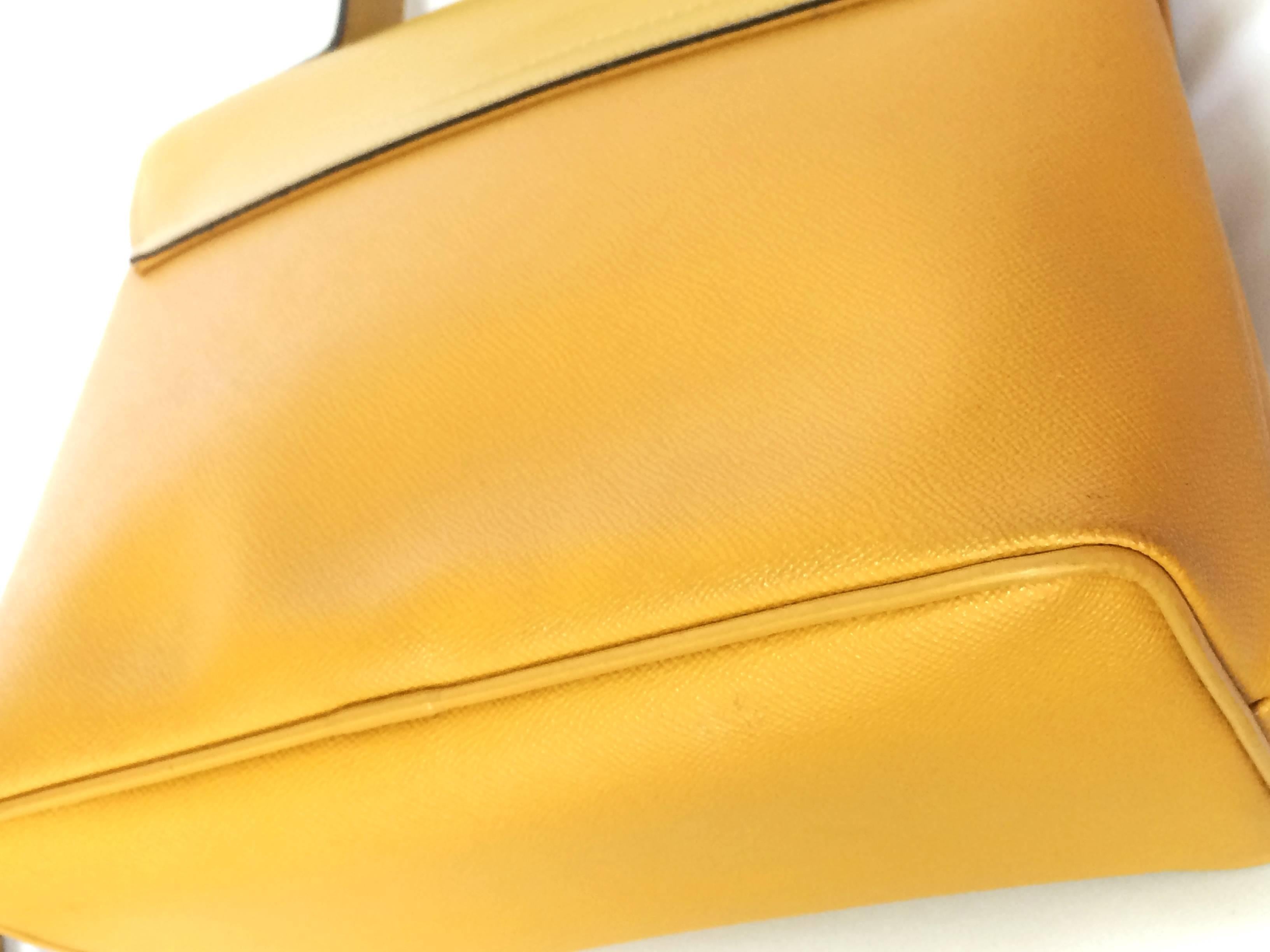 Women's MINT. Vintage Nina Ricci yellow leather handbag purse with shoulder strap.