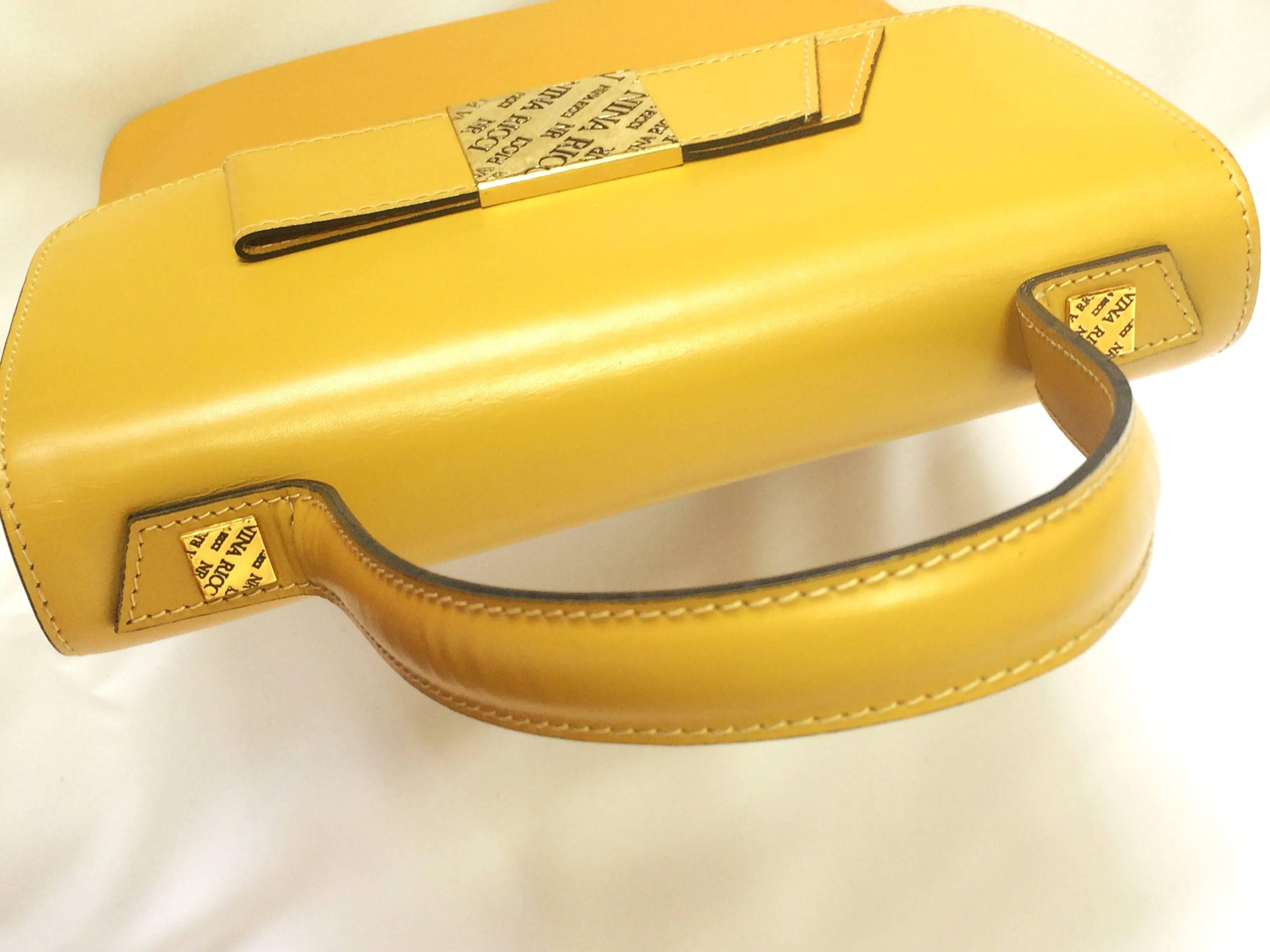 MINT. Vintage Nina Ricci yellow leather handbag purse with shoulder strap. 1