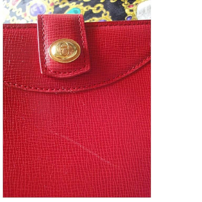 Red Vintage Christian Dior red genuine leather wallet with gold tone CD charm. For Sale