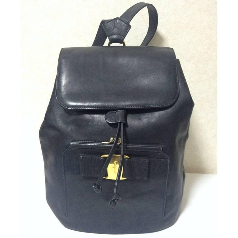 1990. Vintage Salvatore Ferragamo black calf leather backpack from vara collection with kiss lock closure pocket. Rare masterpiece.

Introducing another rare masterpiece from Salvatore Ferragamo black genuine leather backpack with a built-in kiss