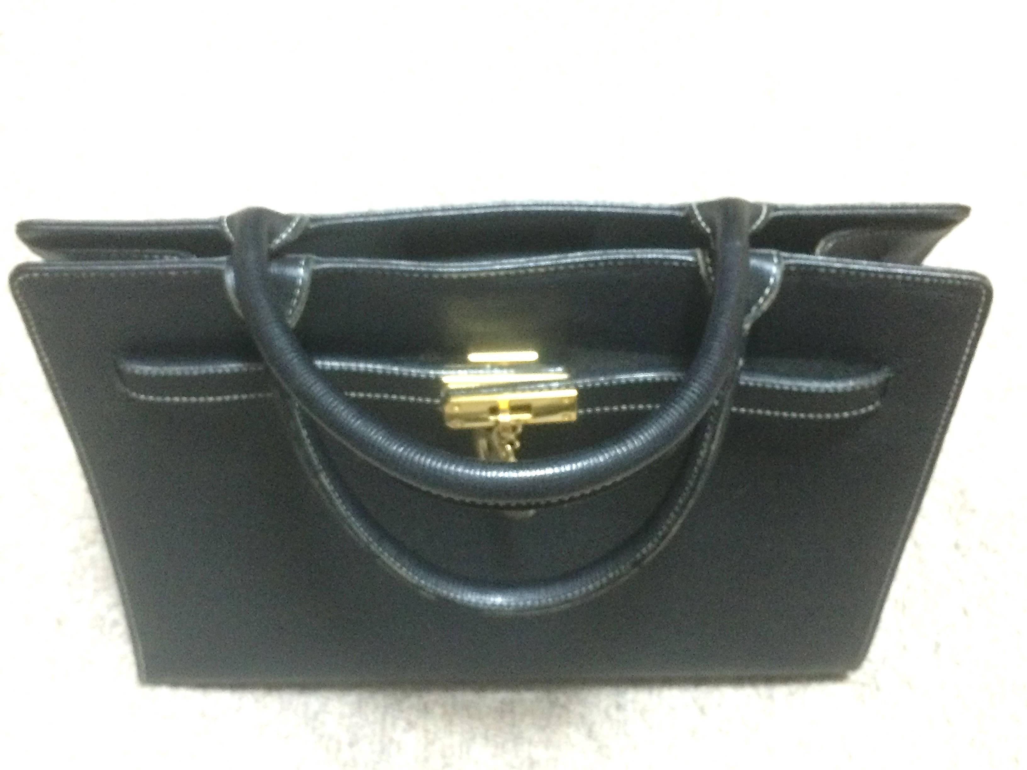 Vintage MOSCHINO black leather tote bag in Kelly purse style with iconic M charm For Sale 1