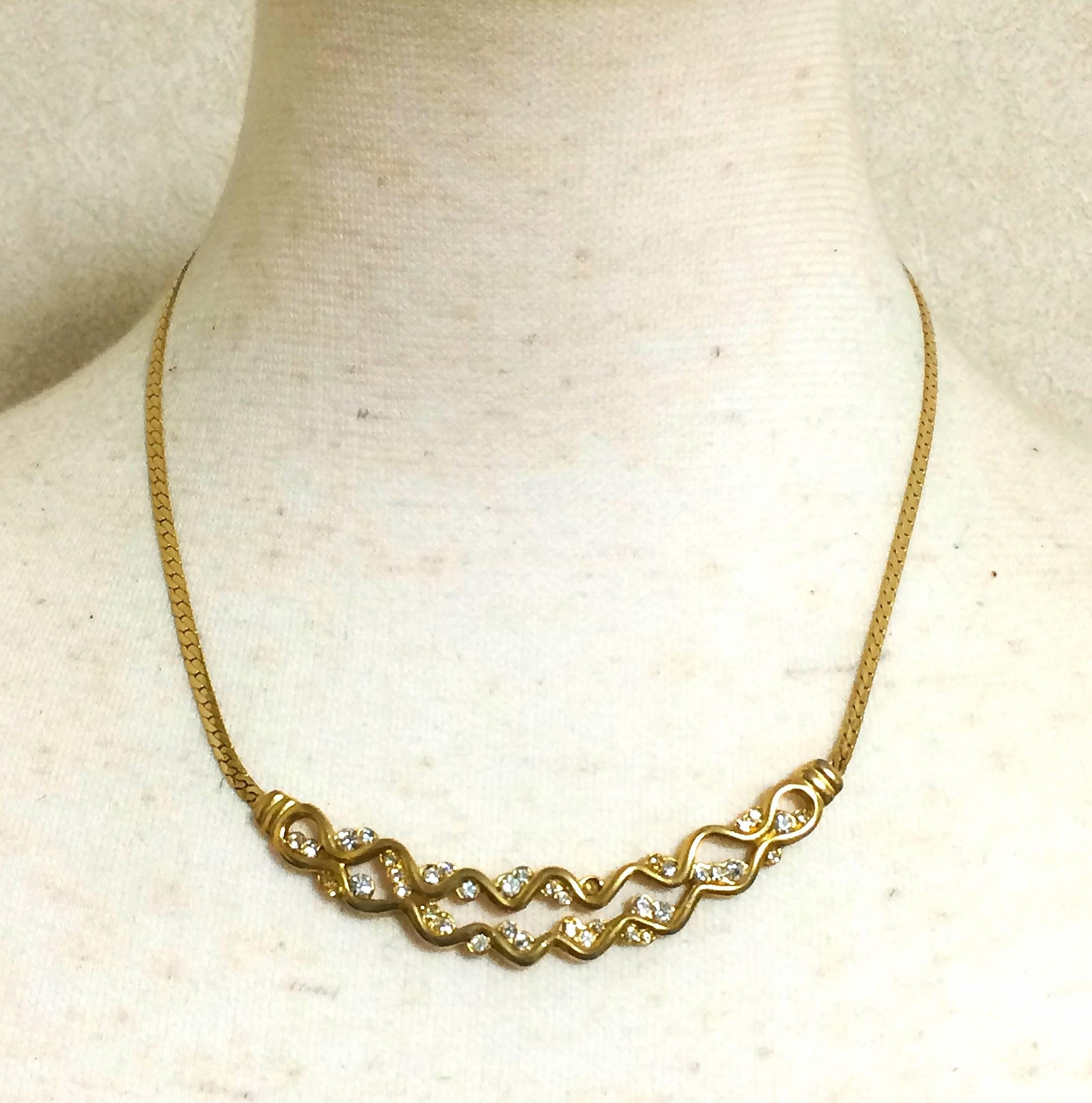 1990s. Vintage Givenchy double wave design flap chain necklace with rhinestone crystals. Classic and simple statement necklace in the era. Audrey Hepburn

Another FAB and stunning jewelry necklace from GIVENCHY back in 90's.
Flat chain necklace