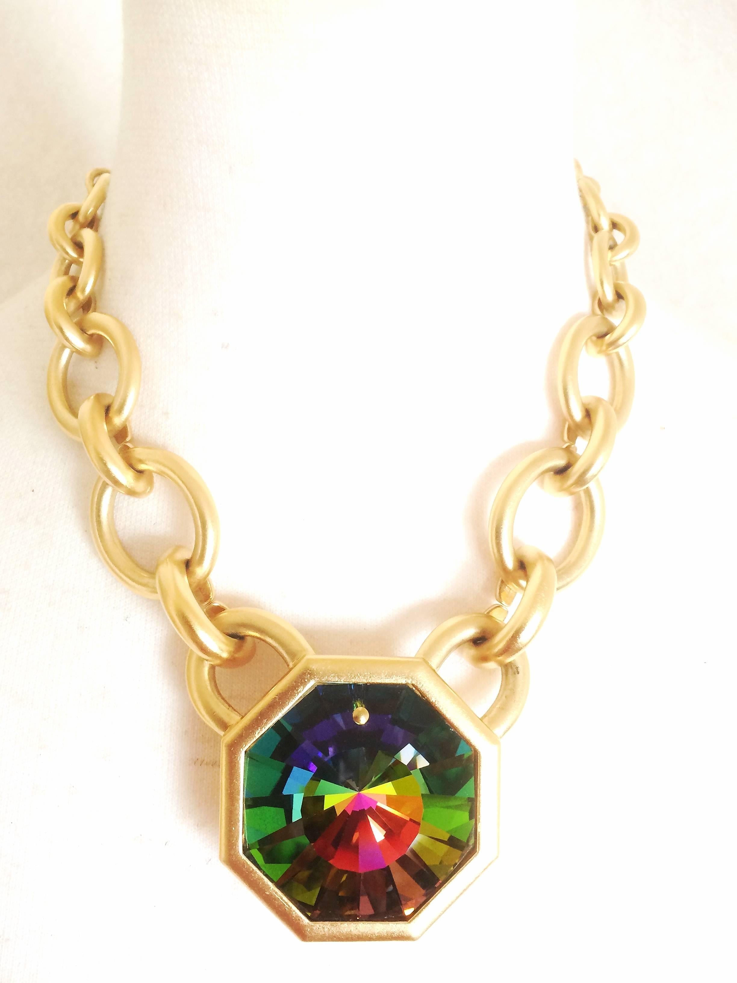 MINT. Vintage Yves Saint Laurent golden chain statement necklace with extra large octagonal pyramid Swarovski crystal pendant top.

MINT. Vintage Yves Saint Laurent statement necklace with rainbow shining large Swarovski crystal pendant top in
