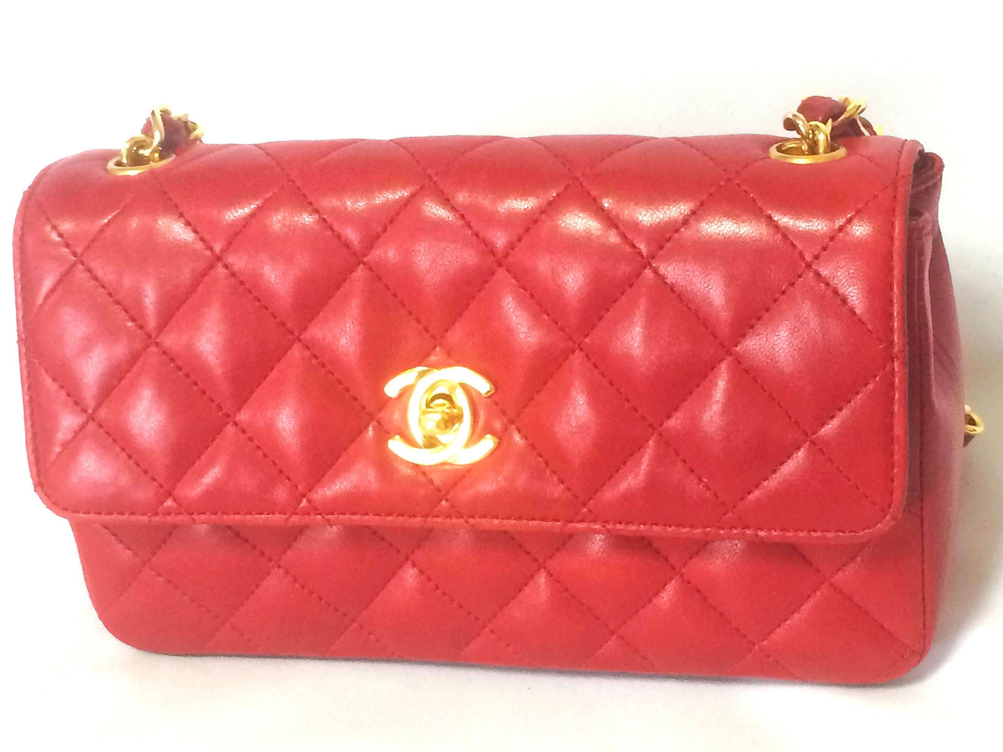 1990s. Vintage CHANEL classic mini flap 2.55 shoulder bag in lipstick red lambskin with golden CC and chain strap. Popular purse back in the era.

Here is another classic and one of the most popular purses from CHANEL....Vintage lambskin mini 2.55