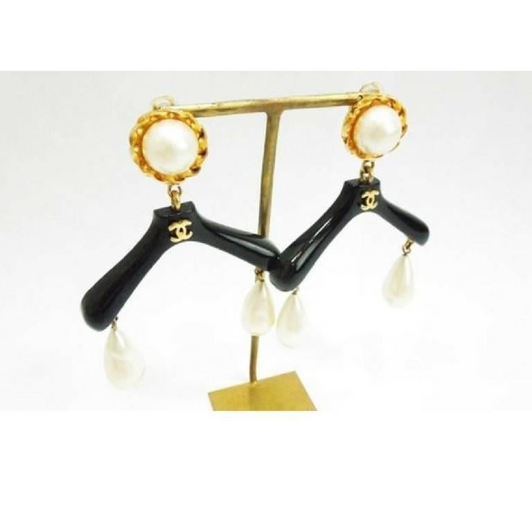 Women's Vintage CHANEL black hanger design dangle earrings with teardrop faux pearls.