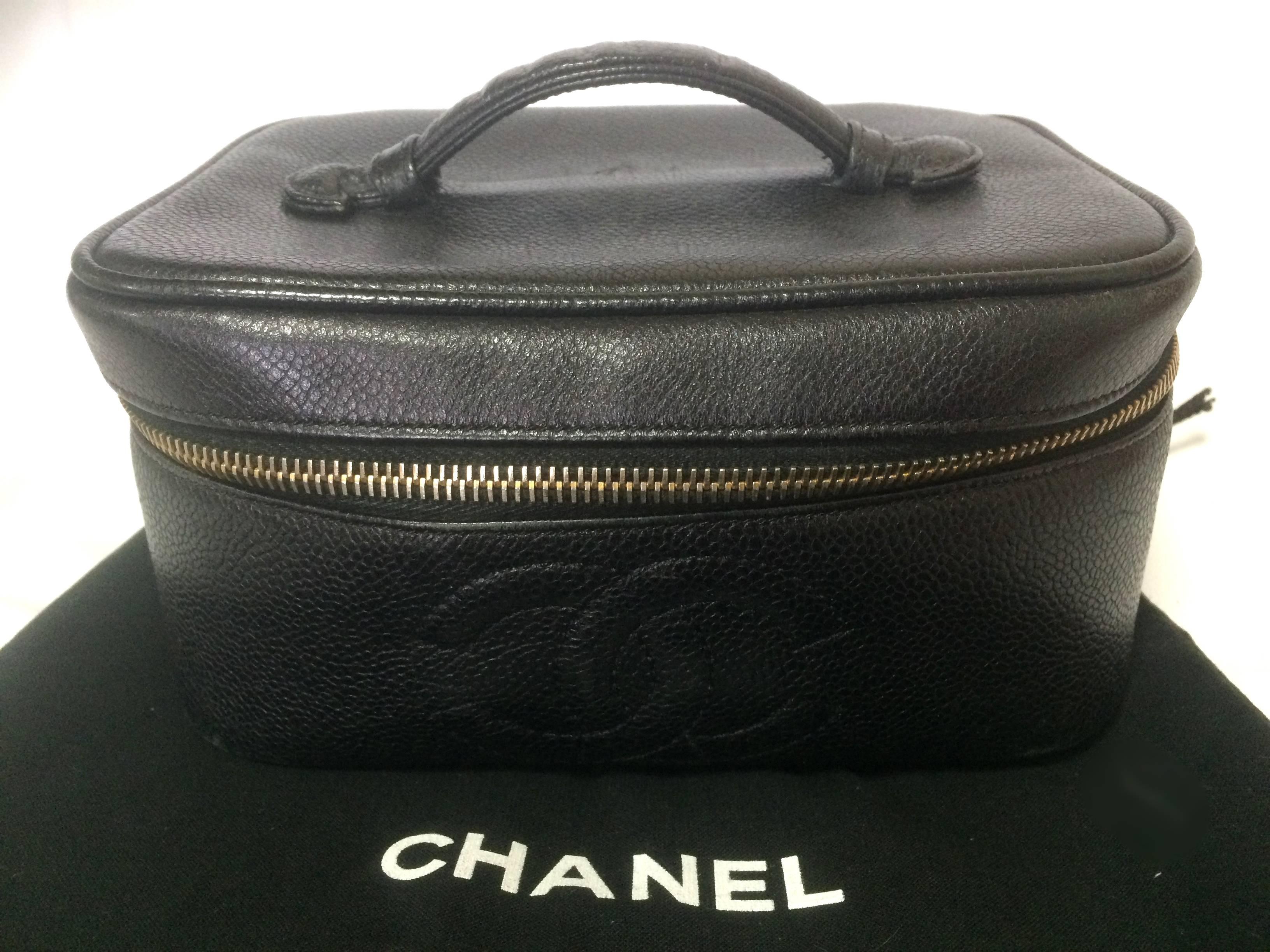 1990s. Vintage CHANEL caviarskin cosmetic, makeup and toiletry black purse. Very chic vanity purse from Chanel back in the era.

This is a 90's vintage CHANEL cosmetic purse made out of caviarskin.
Classic color in black.
Featuring an embossed