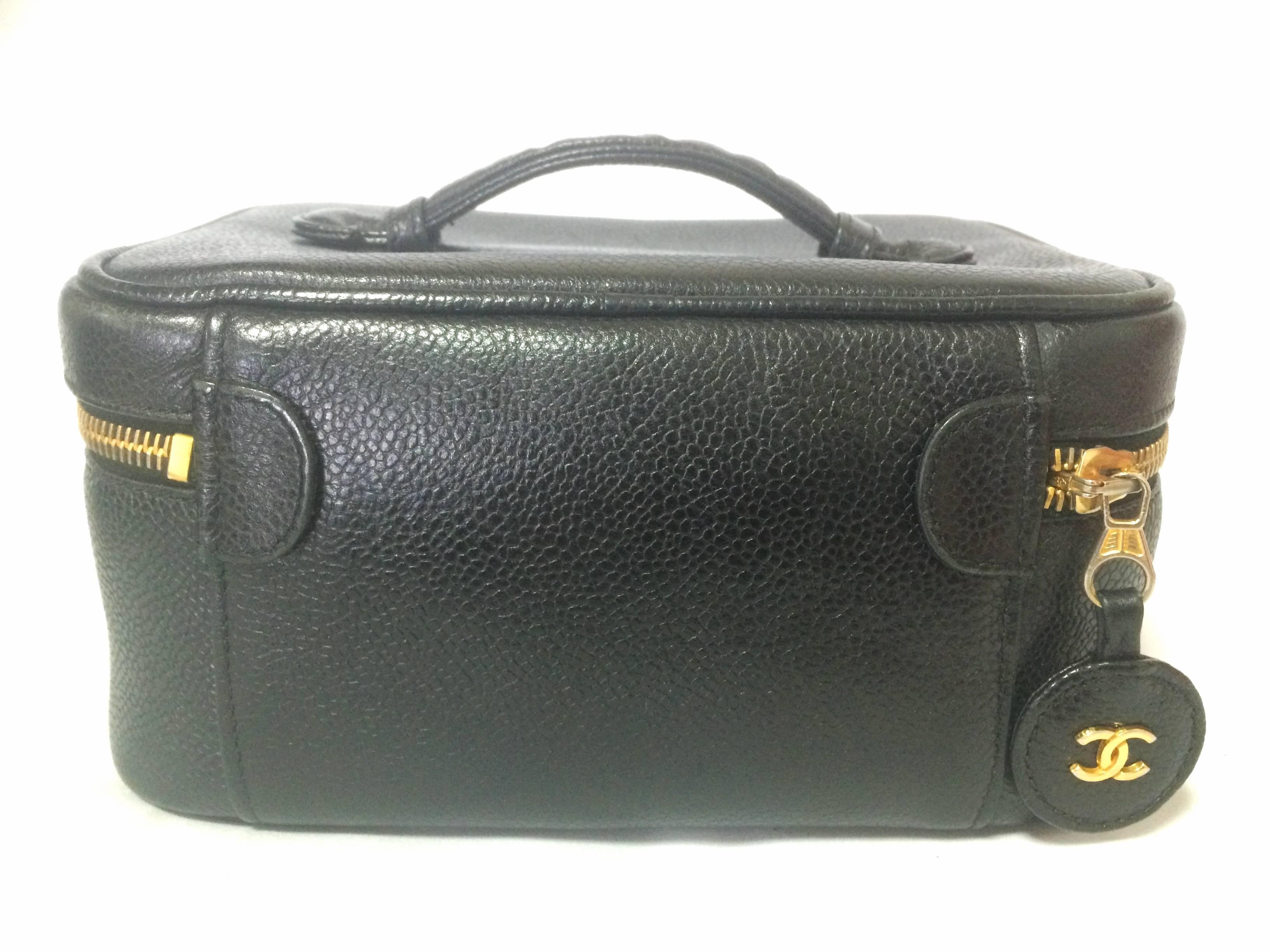 Black Vintage CHANEL caviarskin cosmetic and toiletry black purse. Classic vanity bag.