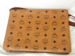 Vintage MCM brown shoulder bag with leather strap, designed by Michael Cromer