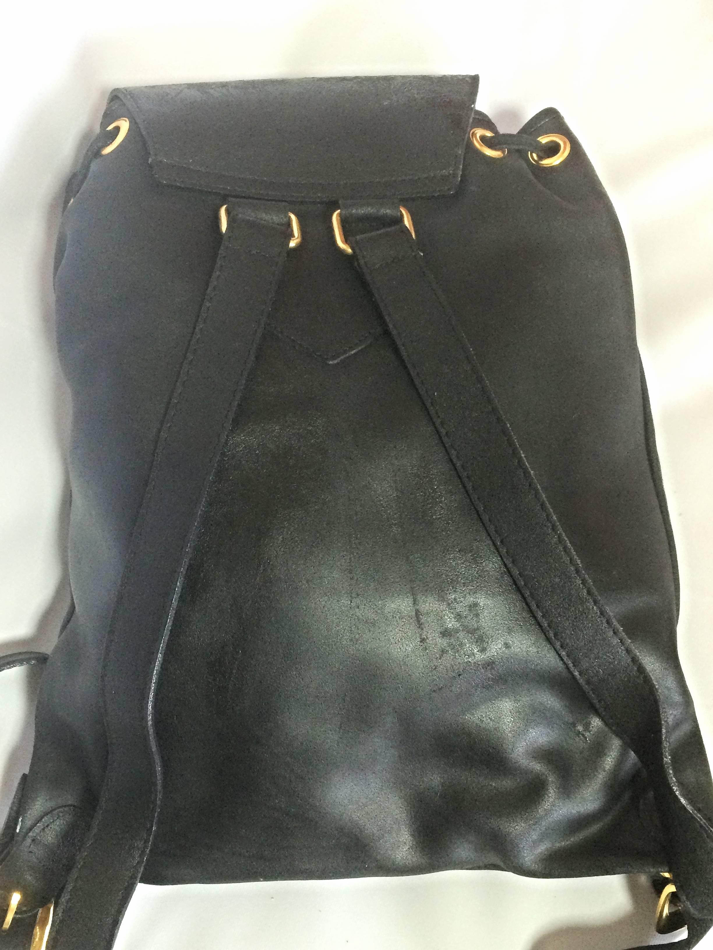 Vintage Gianni Versace black leather backpack with a big embossed medusa mark. In Good Condition In Kashiwa, Chiba