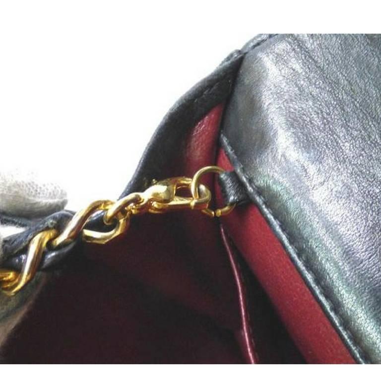 Vintage CHANEL black lambskin 2.55 shoulder bag with golden round cc marks. Rare 2