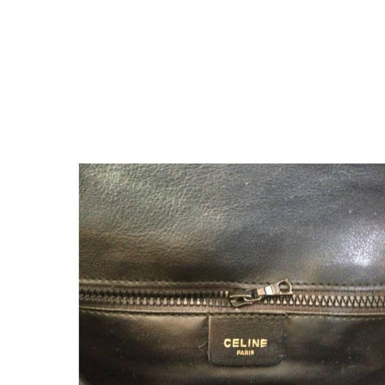 Women's Vintage Celine black and brown genuine leather shoulder bag with logo embossed.