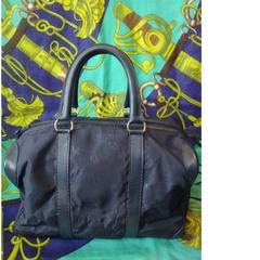 Vintage Christian Dior navy bag in nylon logo jacquard and leather handles.