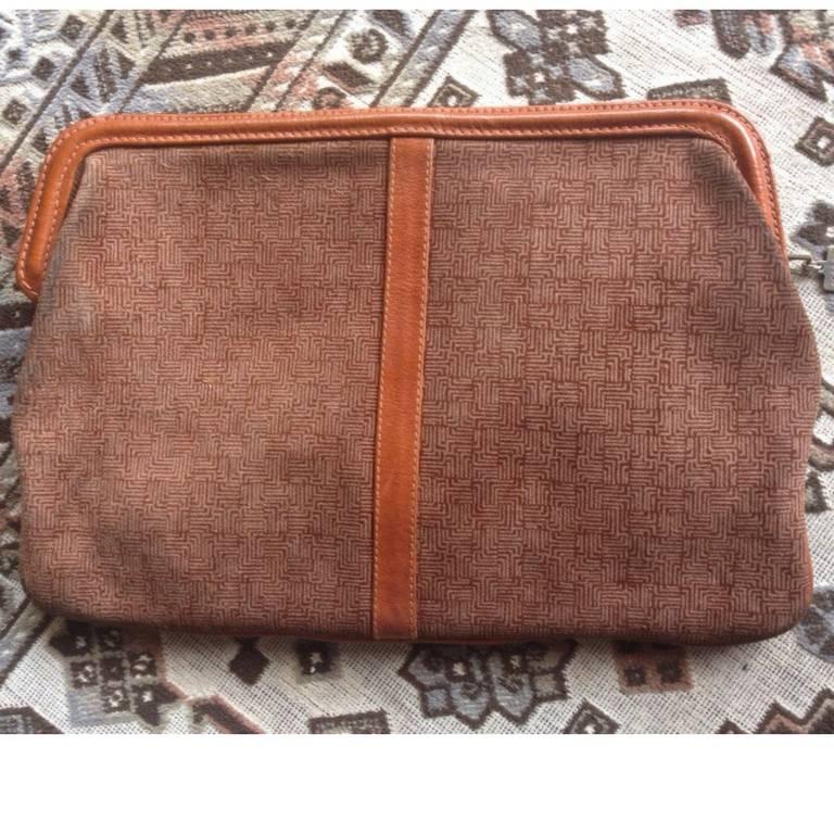 1980s. Vintage LANVIN brown logo printed suede leather pouch bag. Great masterpiece for all generations. unisex. Must Have.

Introducing a vintage LANVIN's rare pouch in genuine suede leather, featuring its iconic logo print all over on the suede