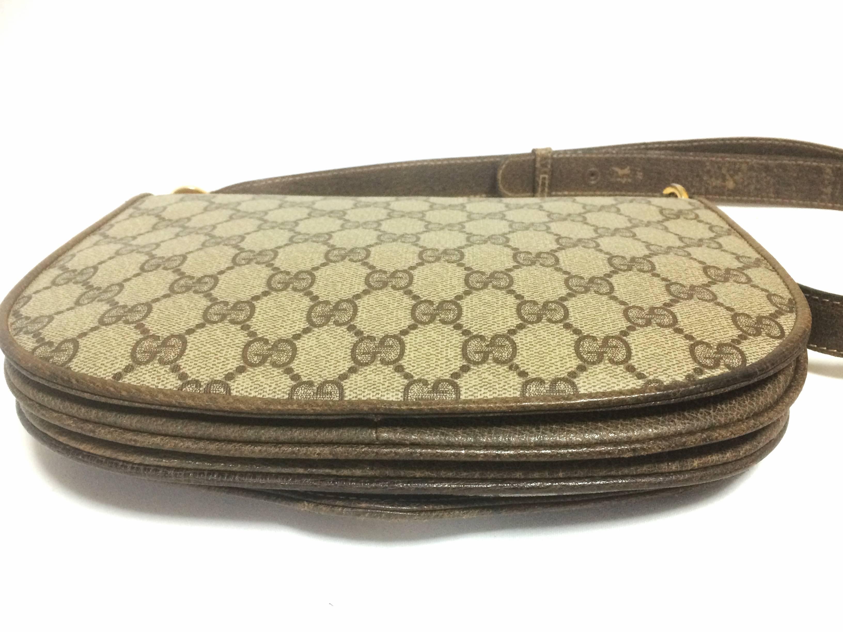 Women's Vintage Gucci brown monogram shoulder bag with golden and silver tone GG closure