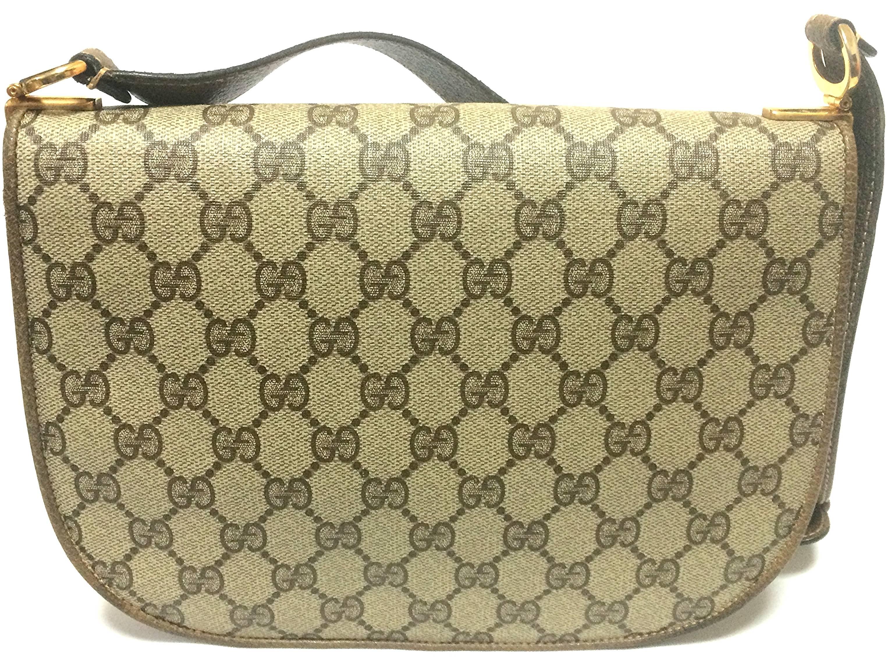 Brown Vintage Gucci brown monogram shoulder bag with golden and silver tone GG closure