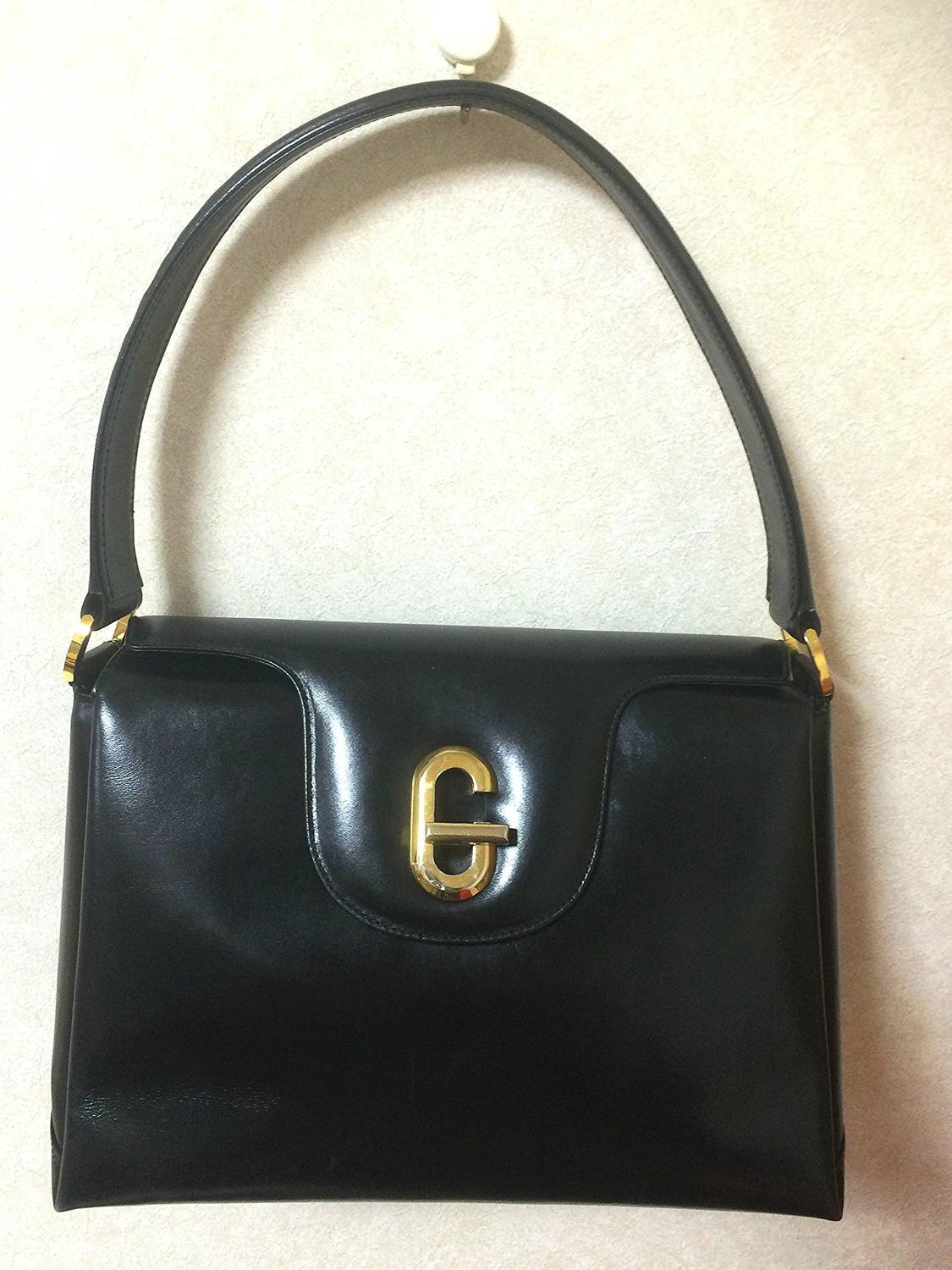 Vintage Gucci black leather classic design handbag purse with G hardware closure at 1stdibs
