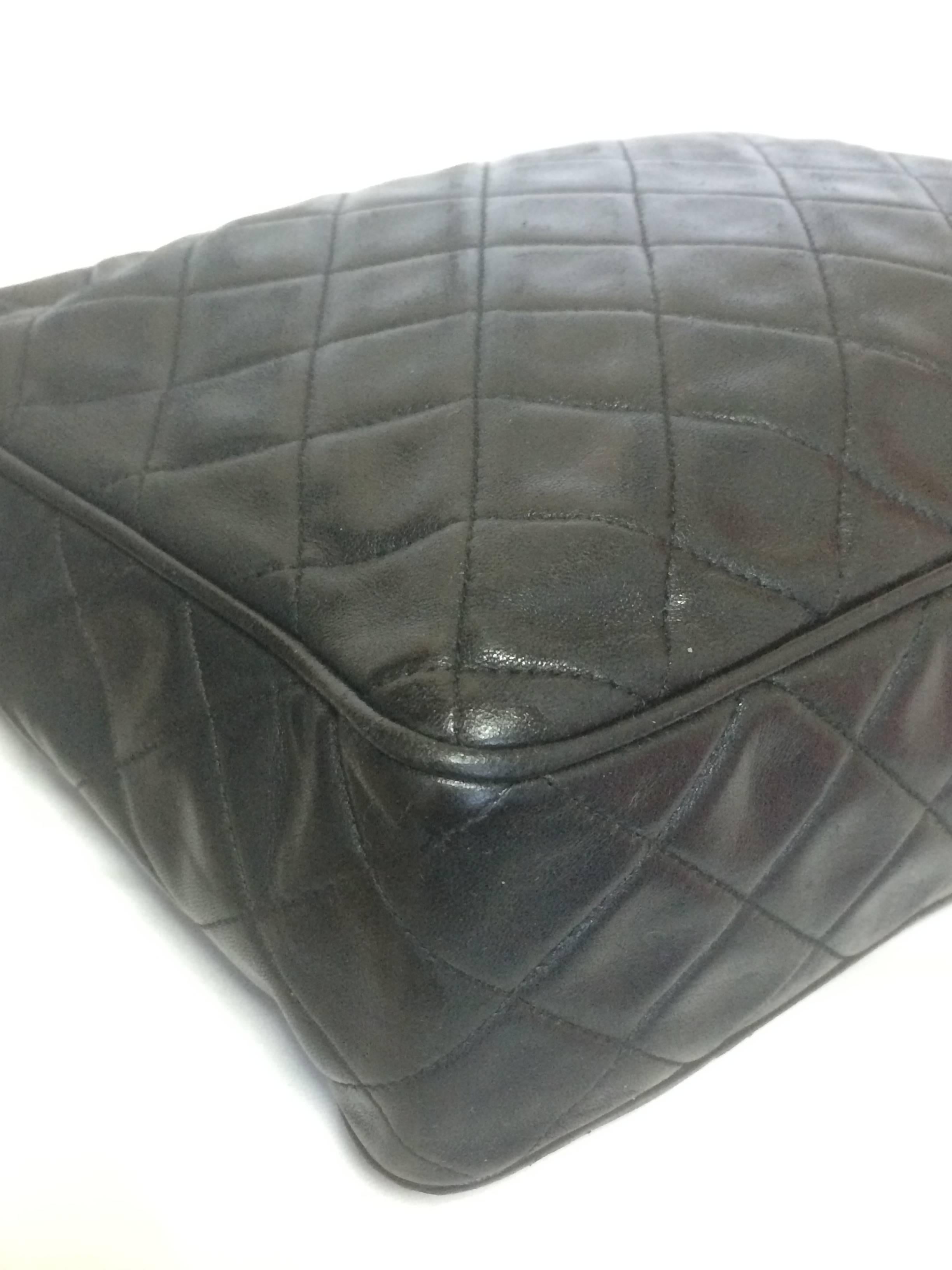 Vintage Chanel black large camera bag style chain shoulder bag with a CC fringe 1