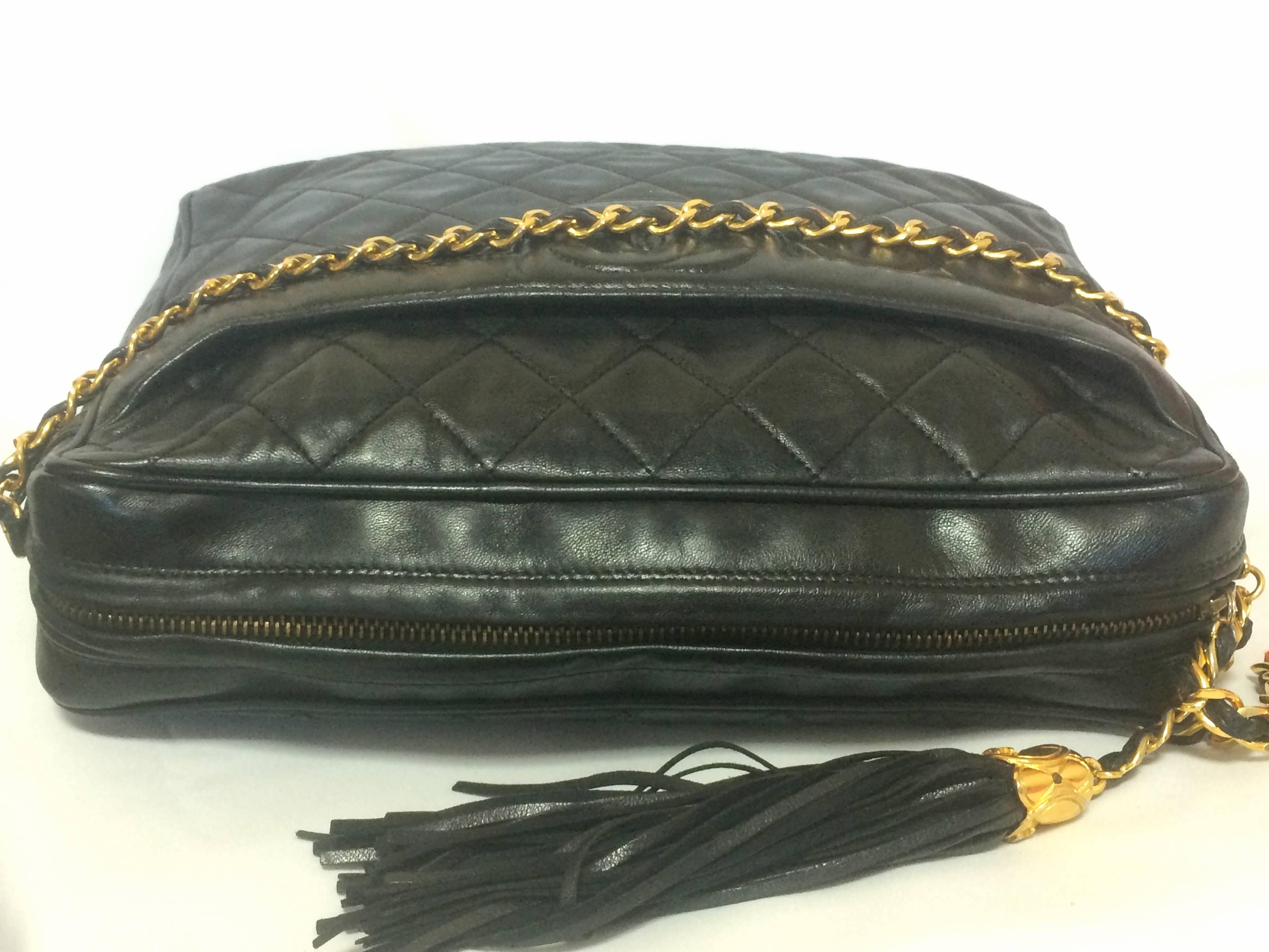 Women's Vintage Chanel black large camera bag style chain shoulder bag with a CC fringe