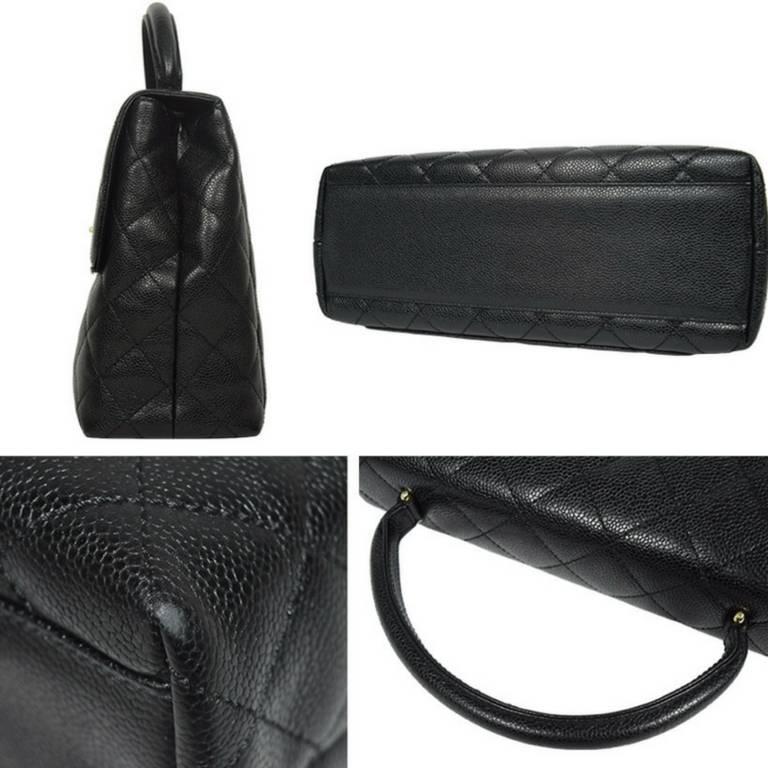 Vintage CHANEL black caviar leather kelly handbag with golden CC closure. 1