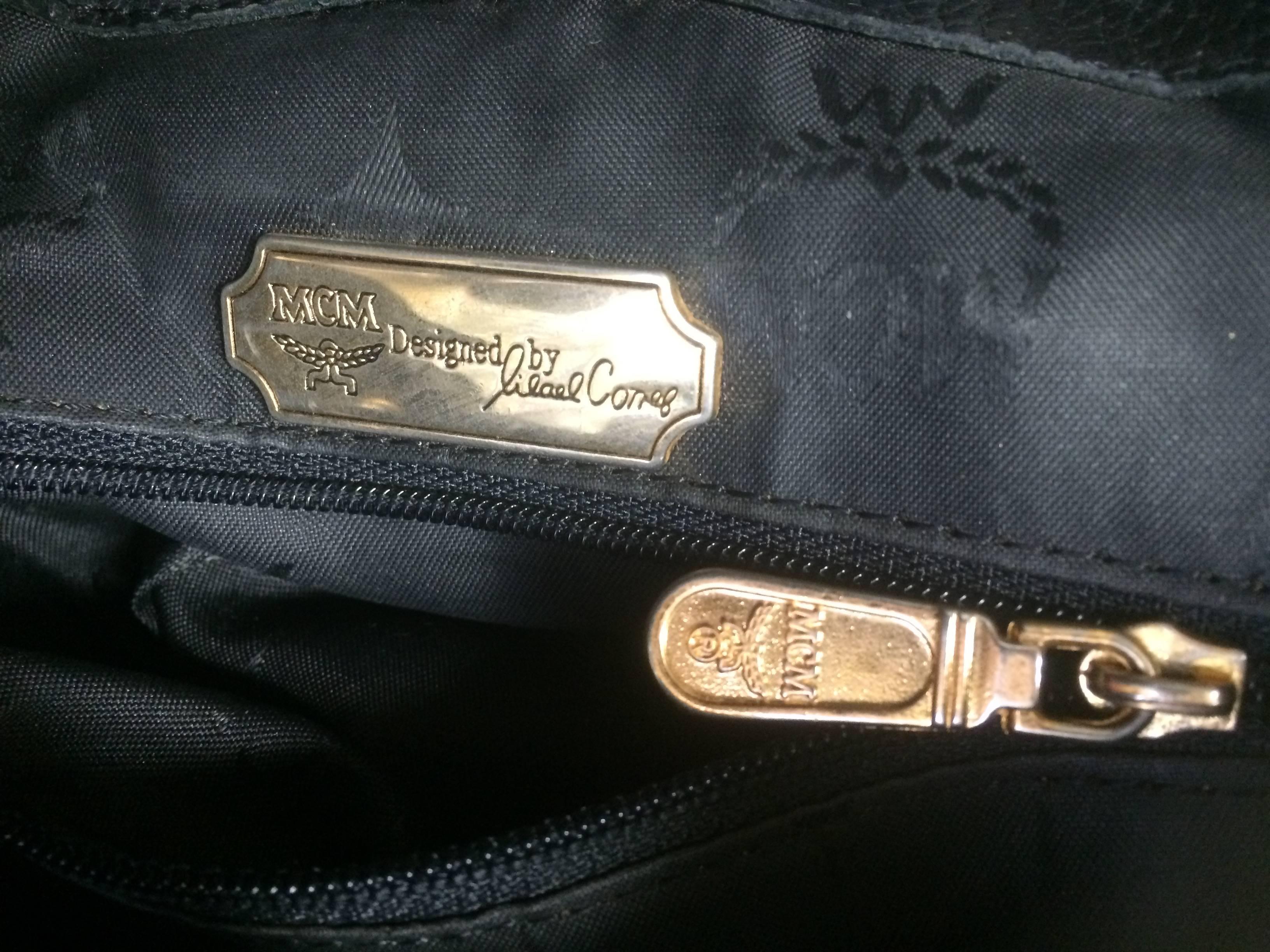 Black Vintage MCM genuine leather black backpack with logo motifs, By Michael Cromer.