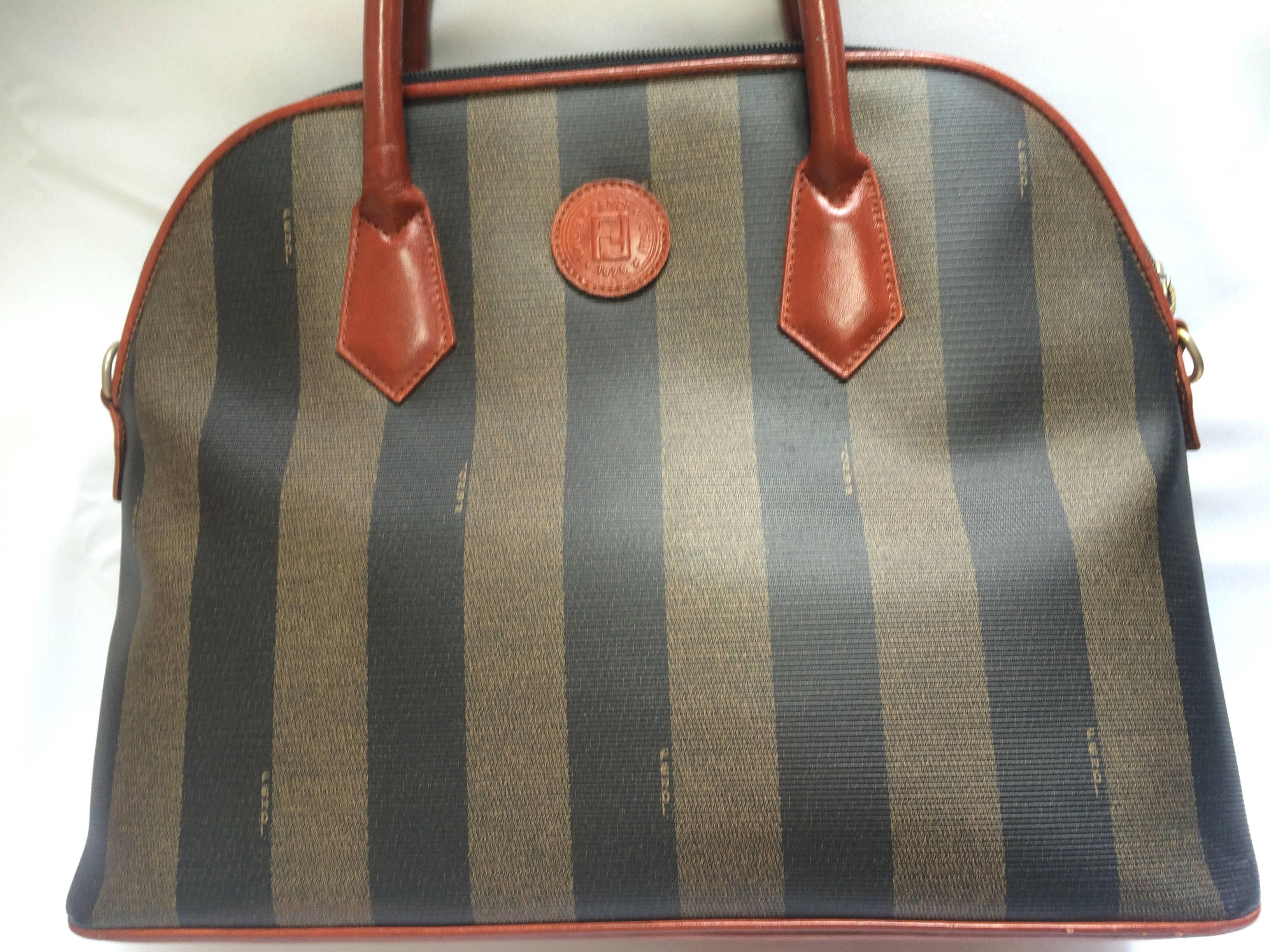 1990s. Vintage FENDI pecan khaki and grey stripe mid size tote bag with brown leather handles and trimmings in bolide shape.

This is a FENDI conic pecan pattern purse in bolide shape from the early 90's. 
Very classic and yet elegant.
Perfect